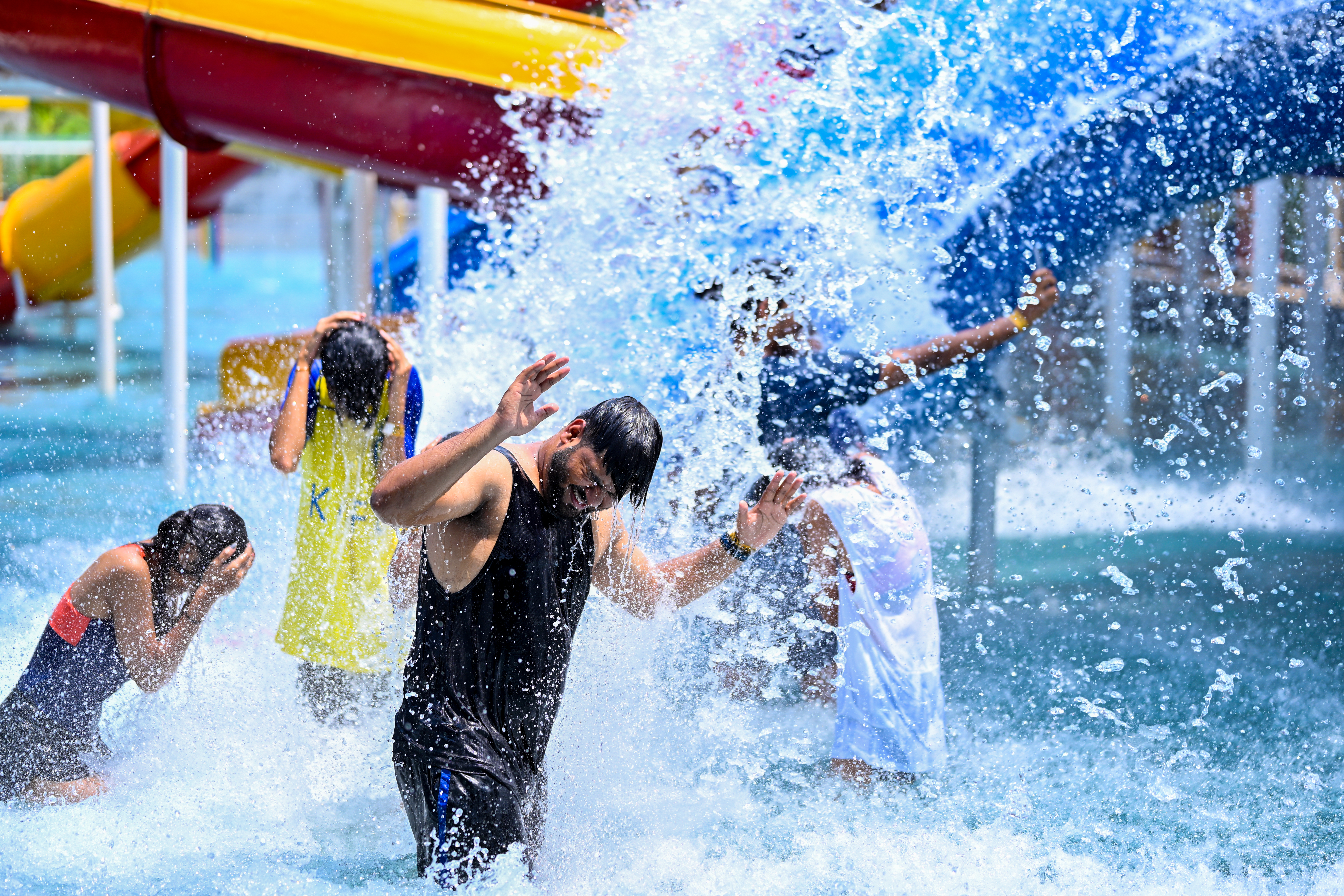 Colorful amusement ride area at Goa Aqua World, featuring vibrant decorations and fun-filled attractions